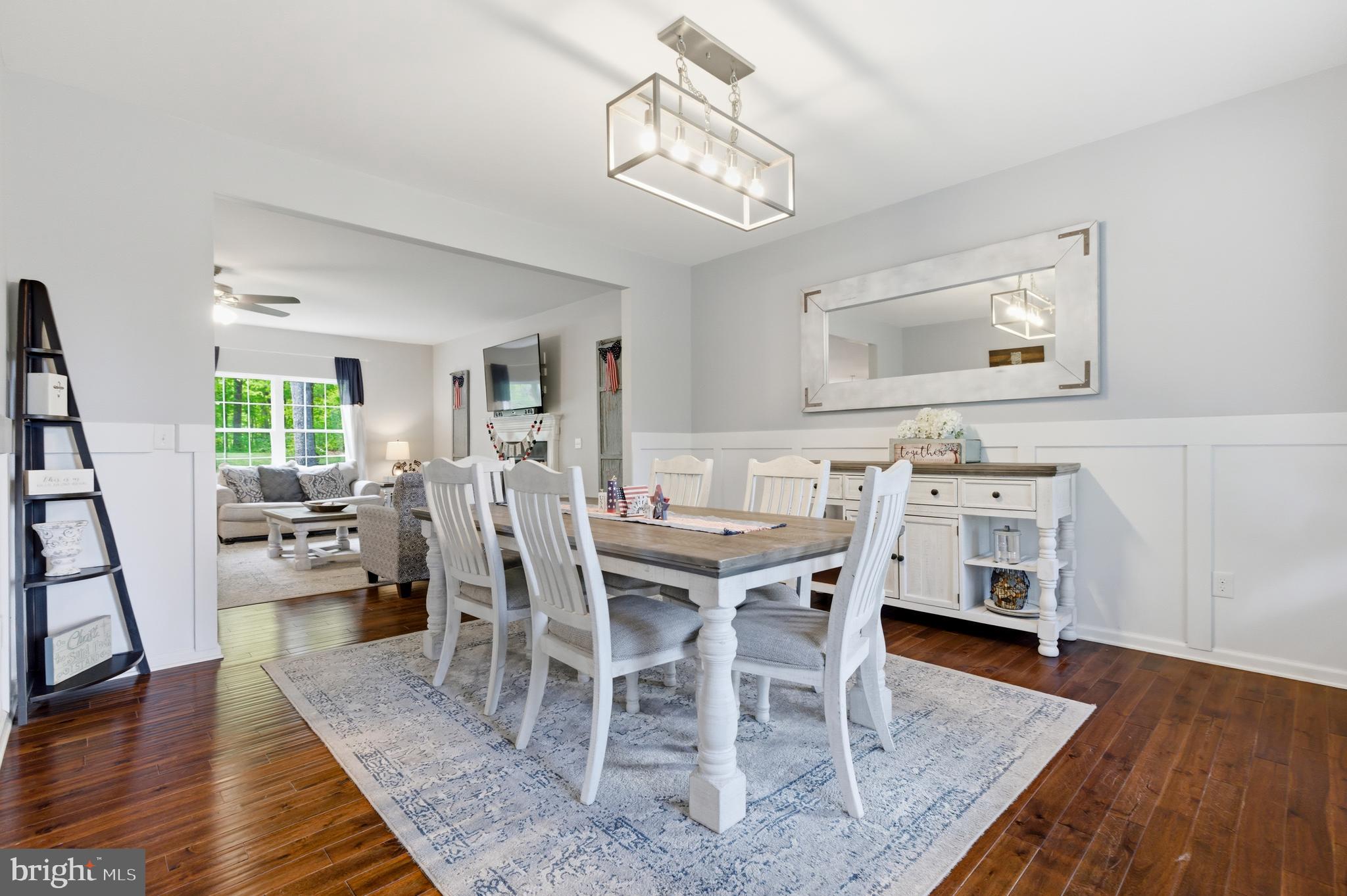 6324 Vint Hill Road Warrenton, VA 20187 - Photo 21 of 103 a view of a dining room with furniture and wooden floor