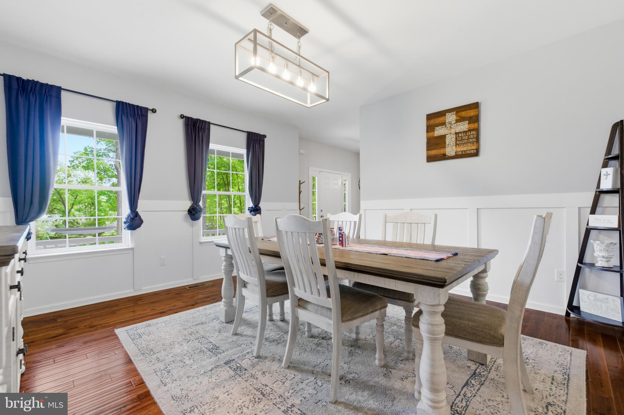 6324 Vint Hill Road Warrenton, VA 20187 - Photo 22 of 103 a view of a dining room with furniture a rug and wooden floor