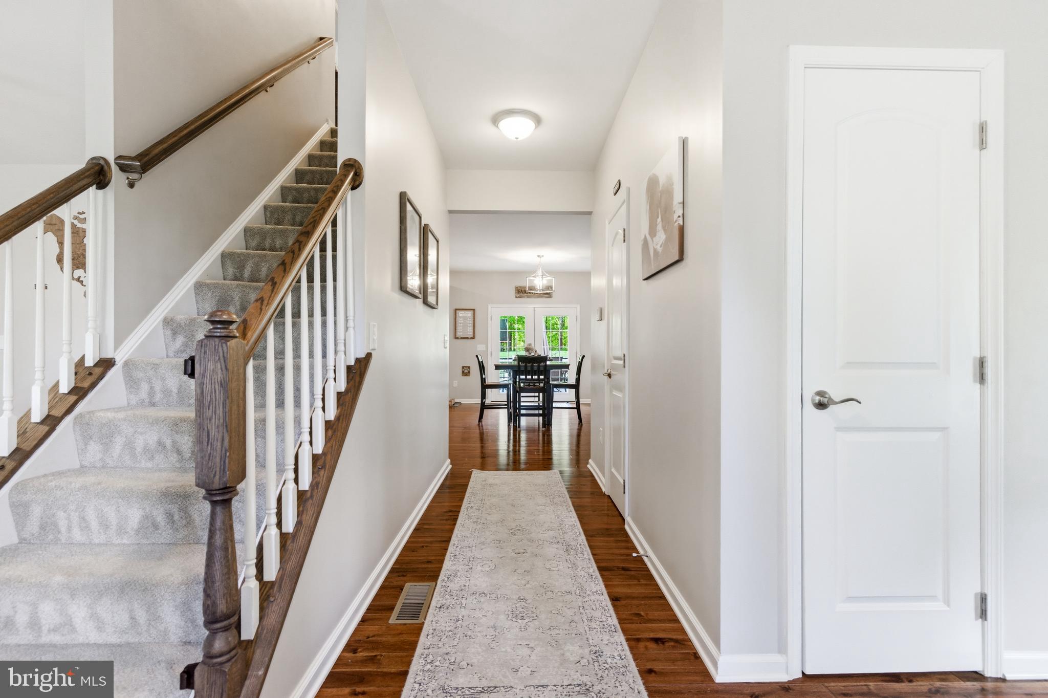 6324 Vint Hill Road Warrenton, VA 20187 - Photo 23 of 103 a view of a hallway with wooden floor and staircase
