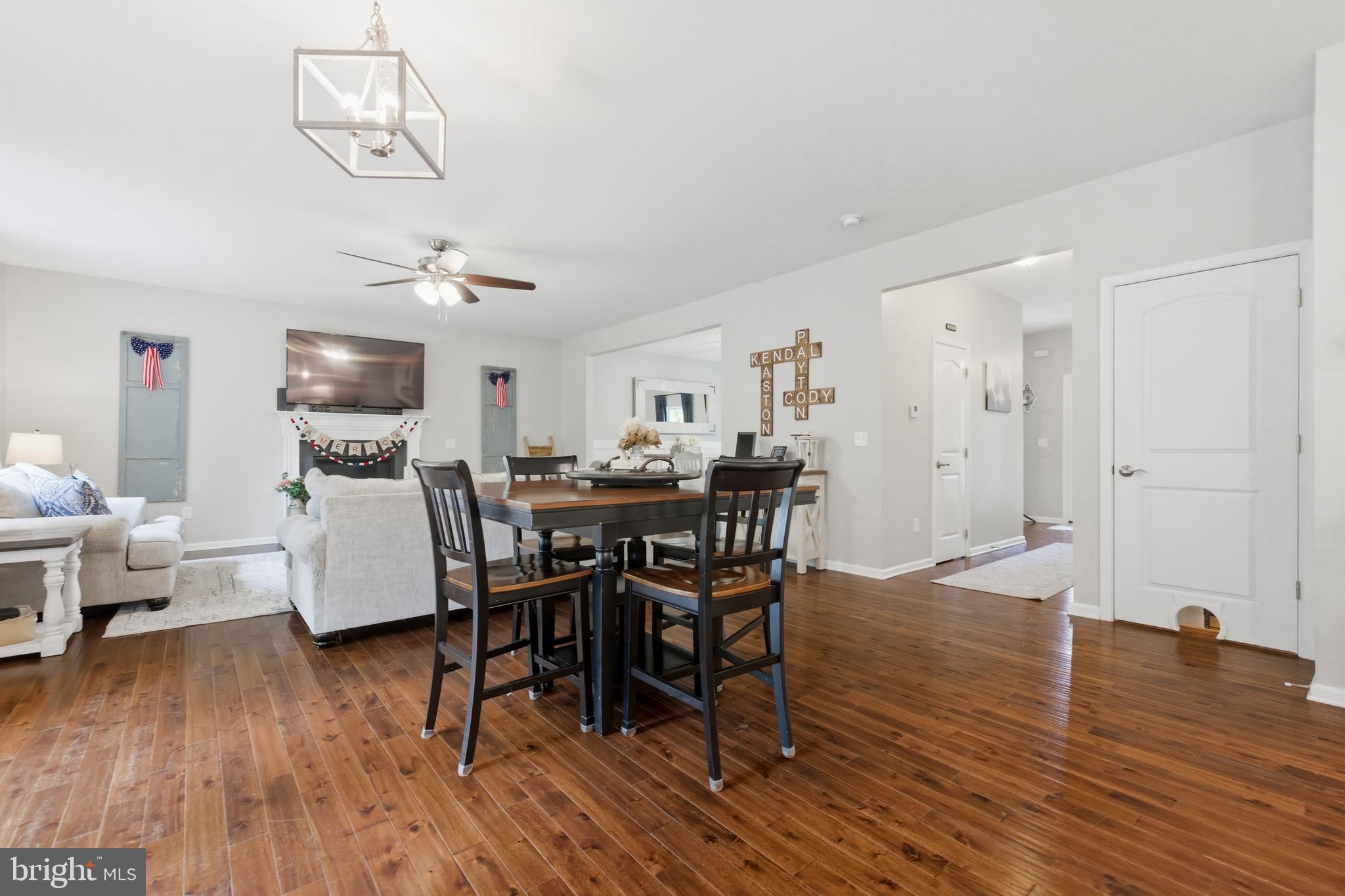 6324 Vint Hill Road Warrenton, VA 20187 - Photo 24 of 103 a view of a dining room with furniture and wooden floor