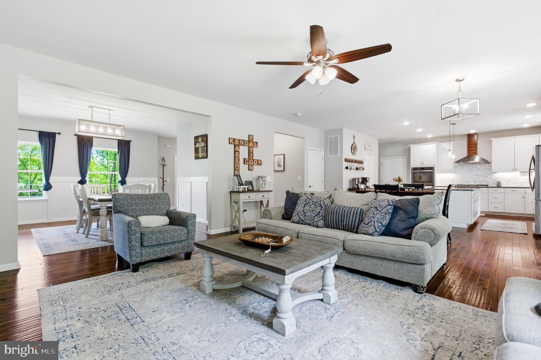 6324 Vint Hill Road Warrenton, VA 20187 - Photo 29 of 103 a living room with furniture kitchen view and a wooden floor