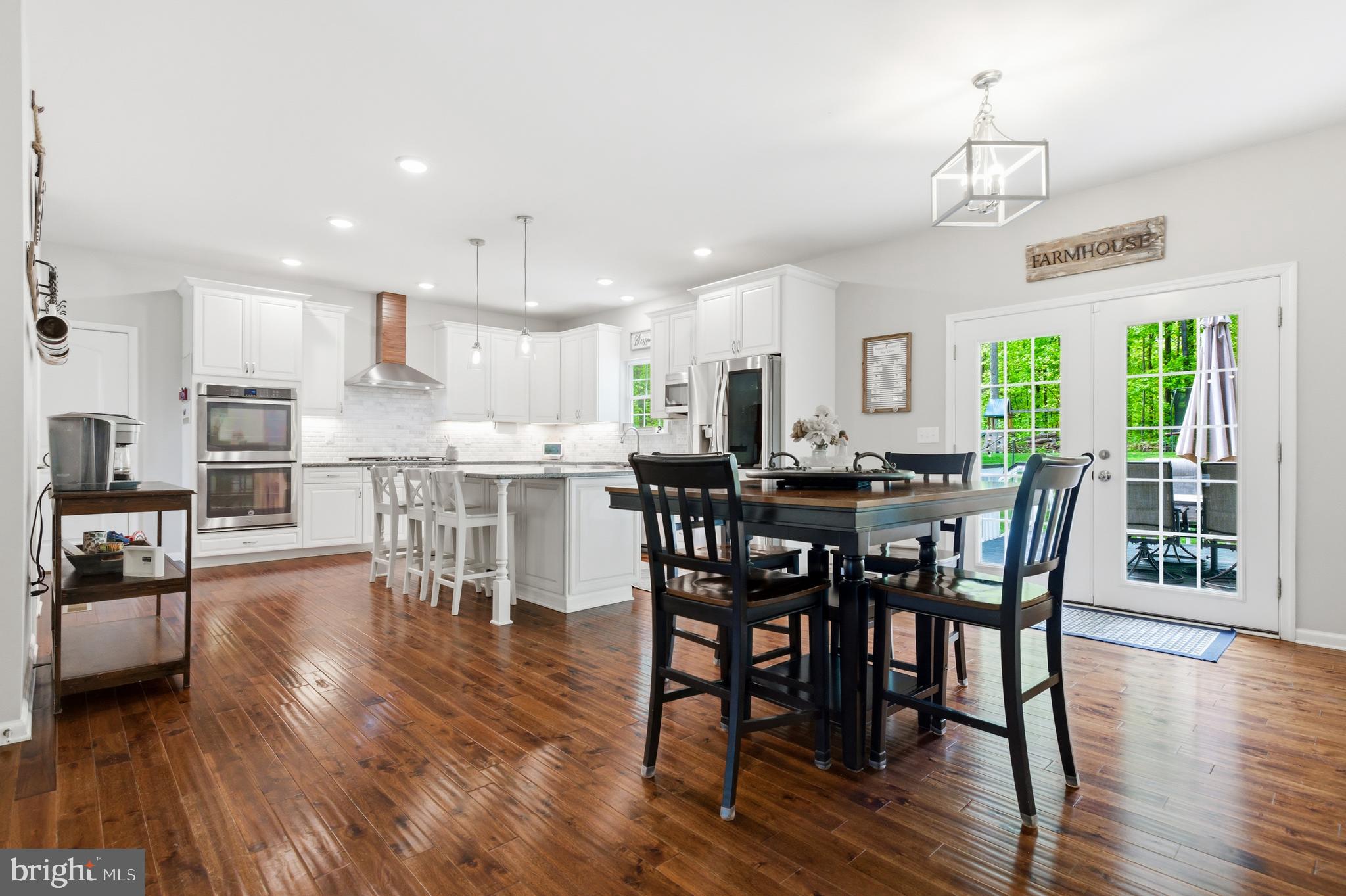 6324 Vint Hill Road Warrenton, VA 20187 - Photo 30 of 103 a view of a dining room with furniture window and wooden floor