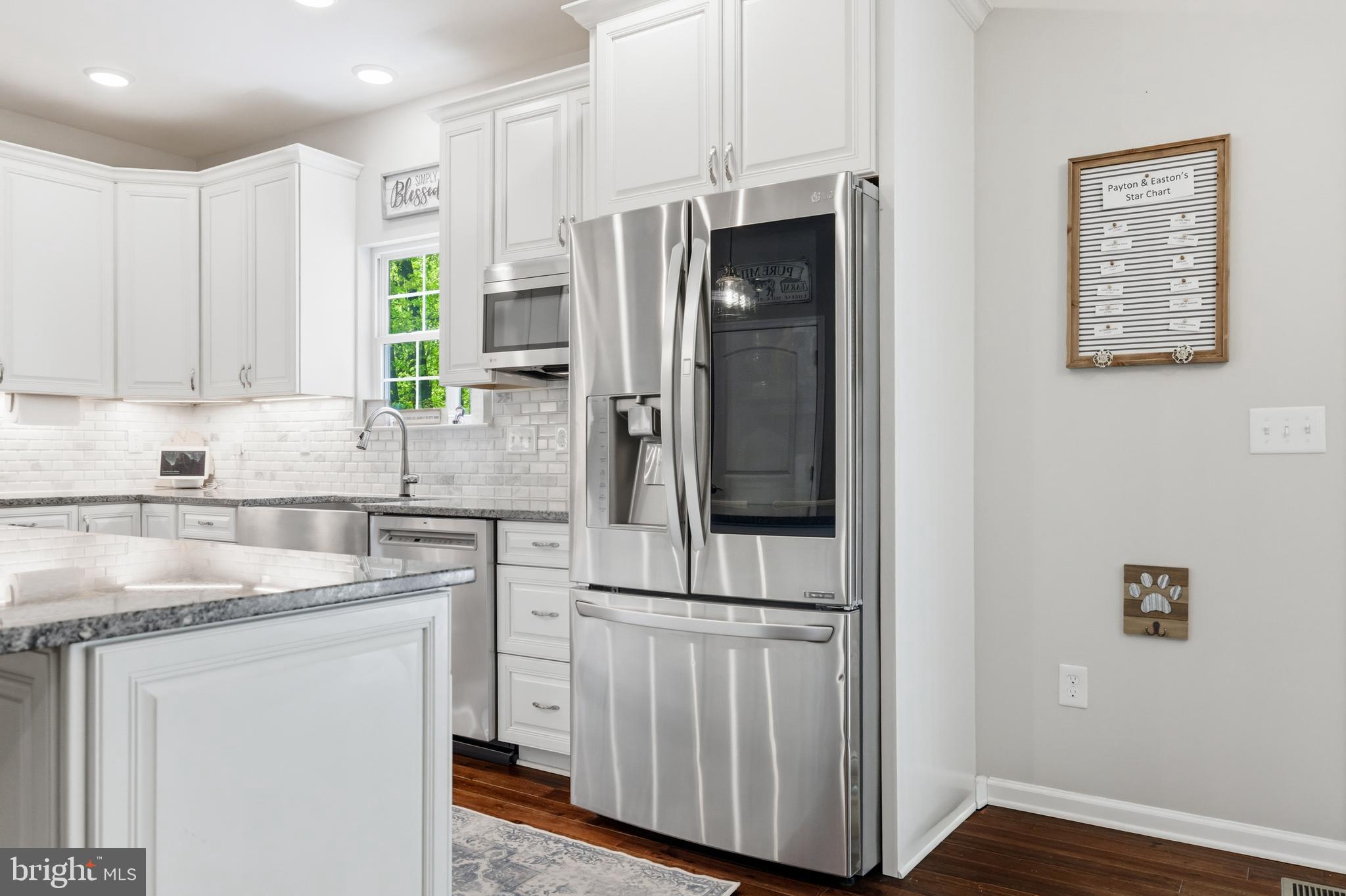 6324 Vint Hill Road Warrenton, VA 20187 - Photo 32 of 103 a kitchen with stainless steel appliances granite countertop a refrigerator and a sink