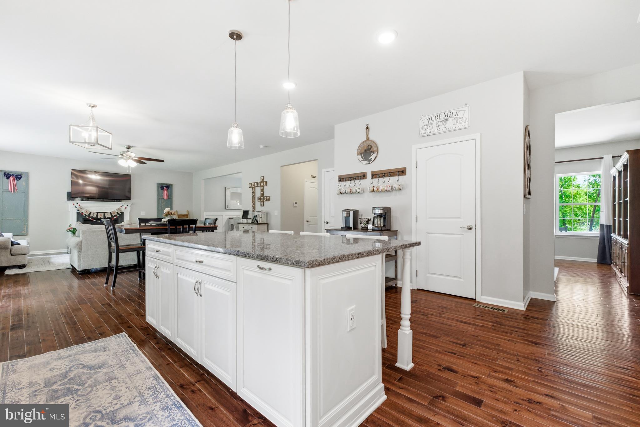 6324 Vint Hill Road Warrenton, VA 20187 - Photo 38 of 103 a kitchen with stainless steel appliances granite countertop a sink stove and wooden floor