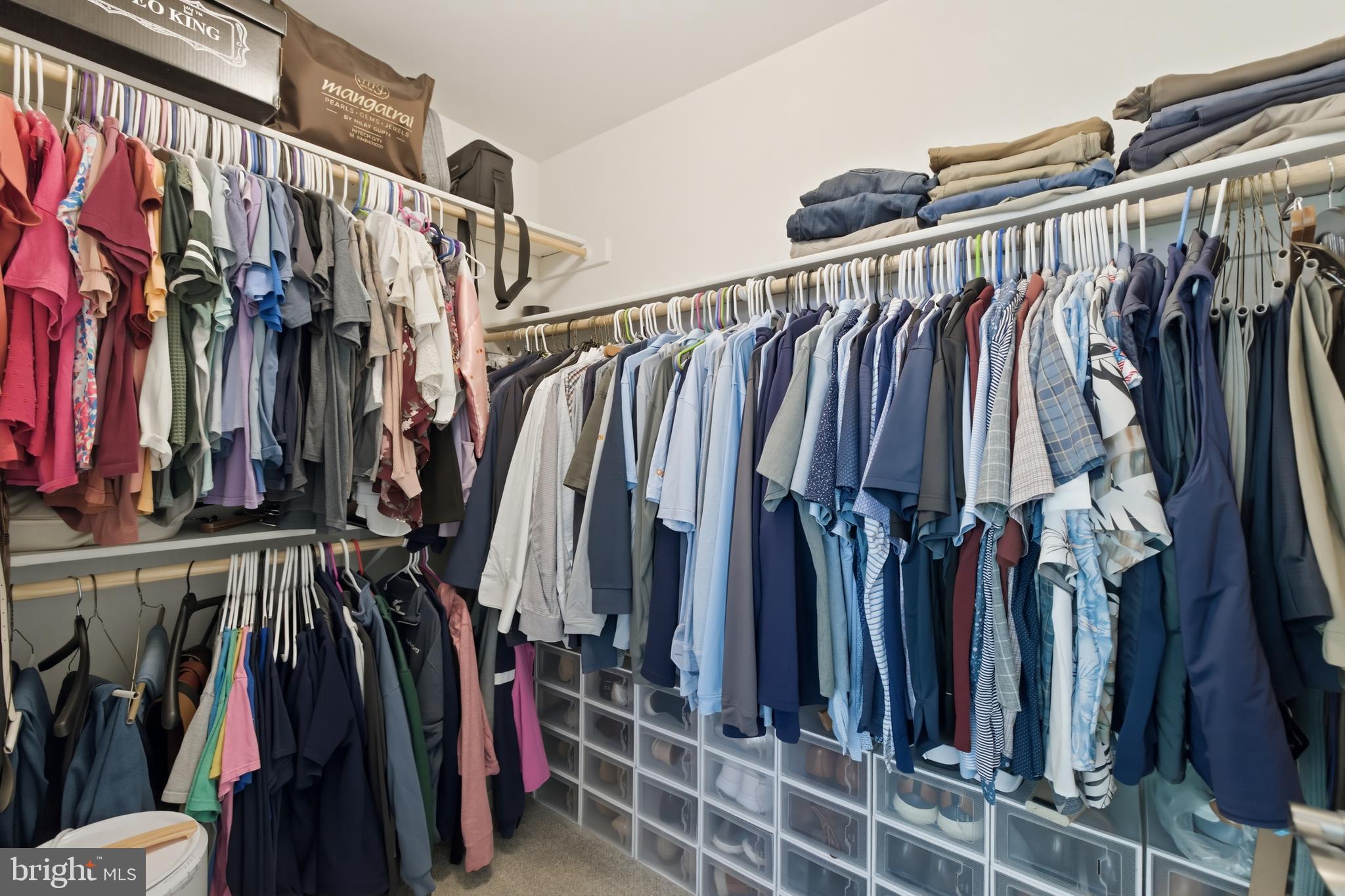 6324 Vint Hill Road Warrenton, VA 20187 - Photo 54 of 103 a view of walk in closet with clothes