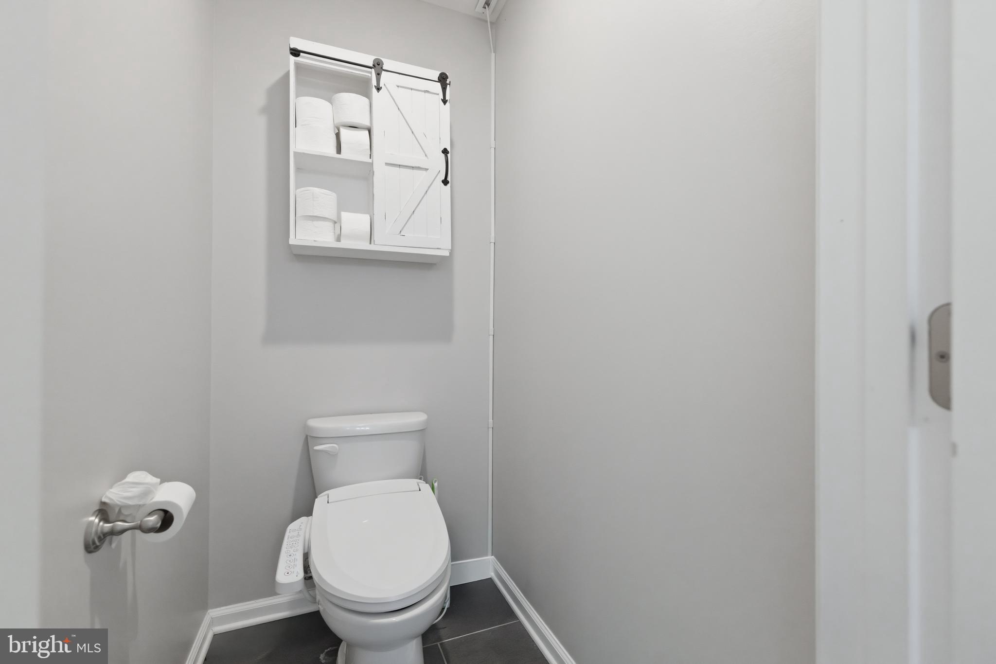 6324 Vint Hill Road Warrenton, VA 20187 - Photo 56 of 103 a white toilet sitting next to a bathroom sink
