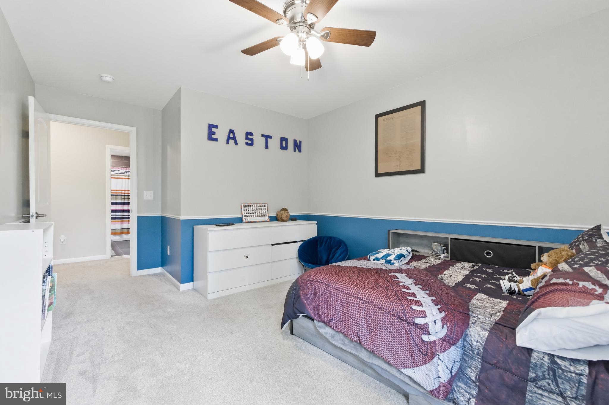 6324 Vint Hill Road Warrenton, VA 20187 - Photo 64 of 103 a bedroom with a bed and a chandelier