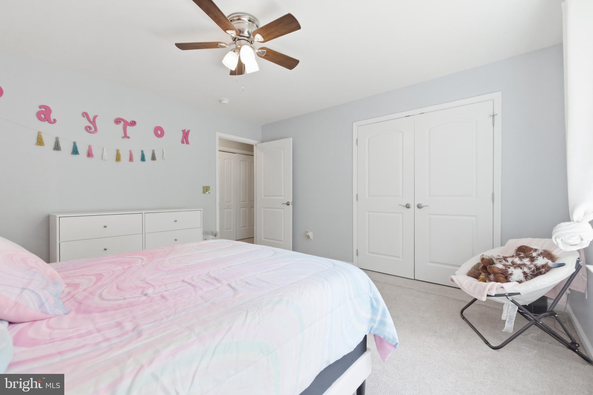 6324 Vint Hill Road Warrenton, VA 20187 - Photo 66 of 103 a bedroom with a bed and a chandelier
