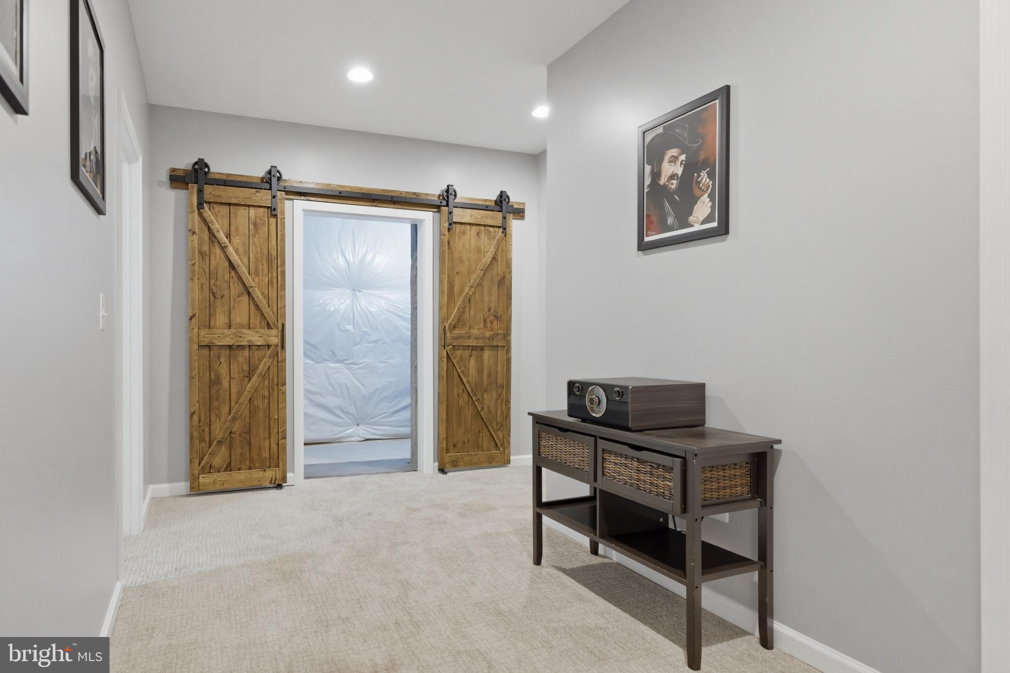 6324 Vint Hill Road Warrenton, VA 20187 - Photo 69 of 103 a view of a hallway with paintings on the wall