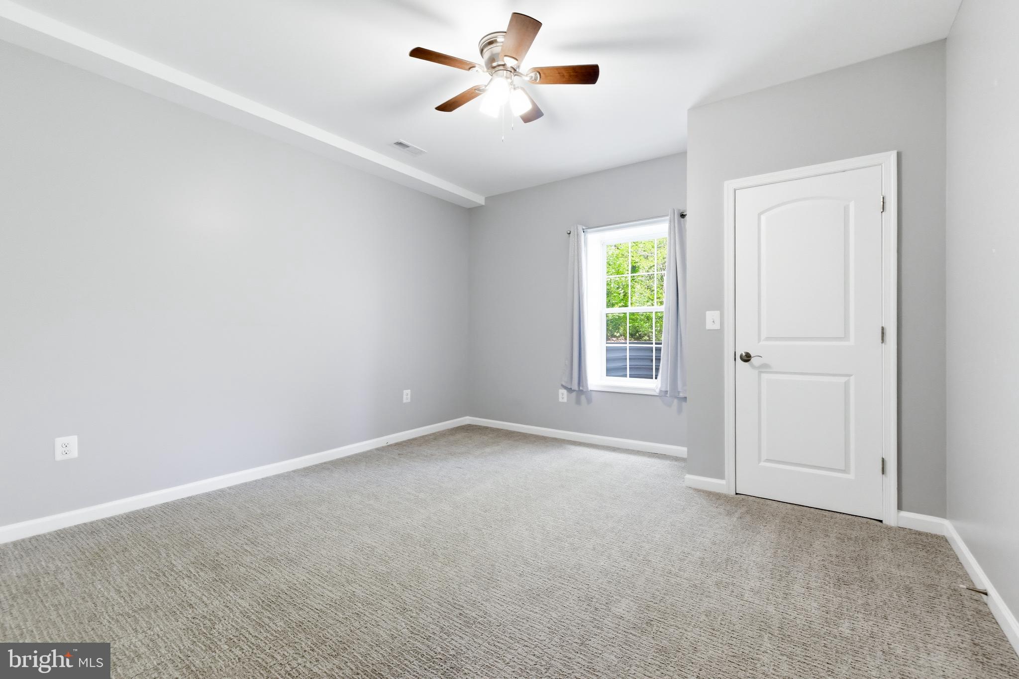 6324 Vint Hill Road Warrenton, VA 20187 - Photo 74 of 103 an empty room with windows and fan