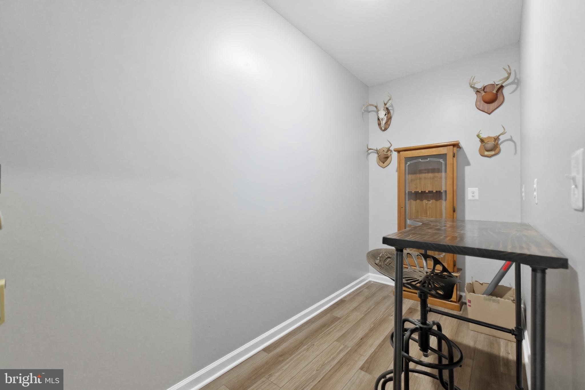 6324 Vint Hill Road Warrenton, VA 20187 - Photo 92 of 103 a view of a hallway with wooden floor and stairs