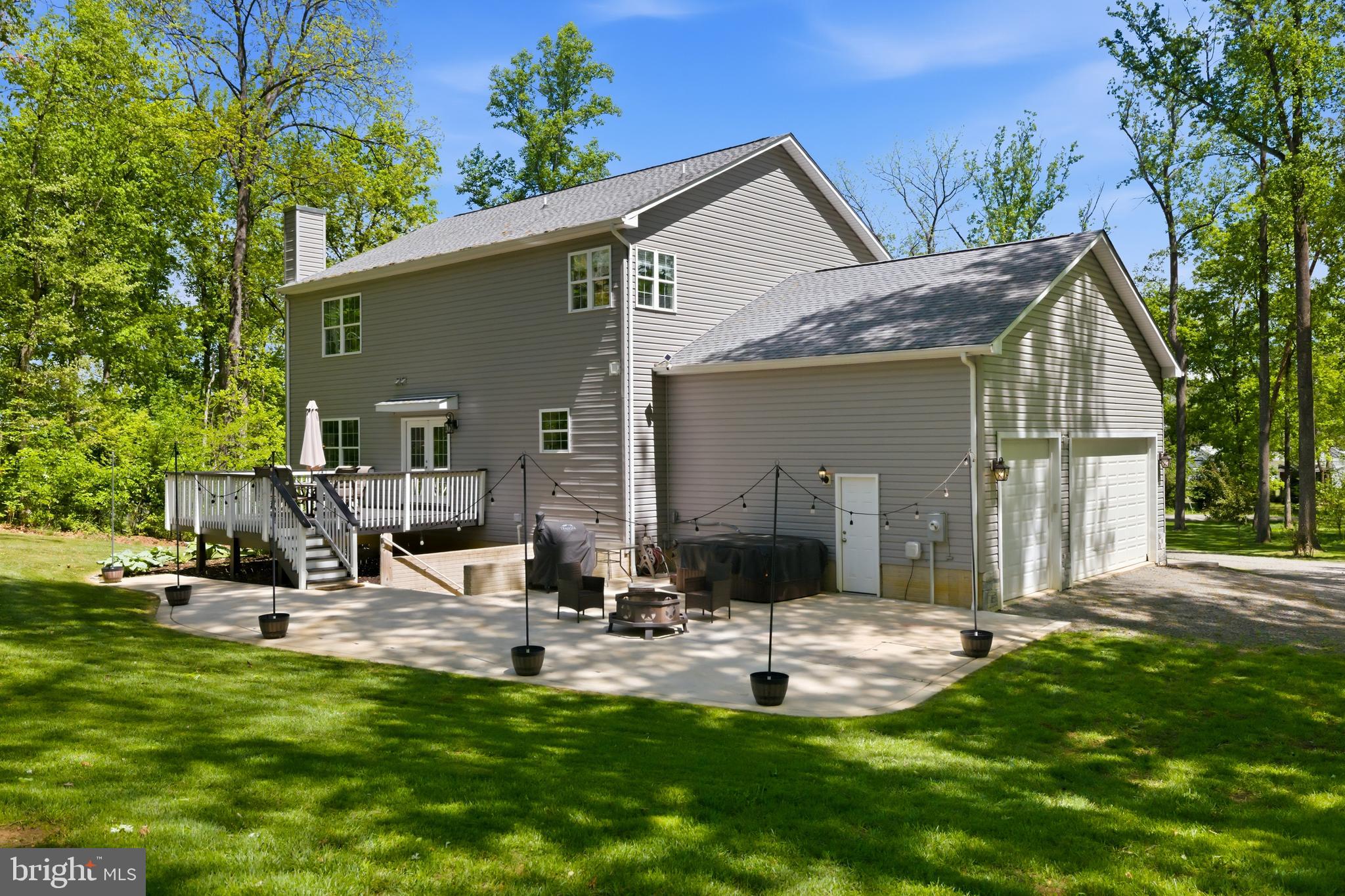 6324 Vint Hill Road Warrenton, VA 20187 - Photo 99 of 103 a backyard of a house with table and chairs
