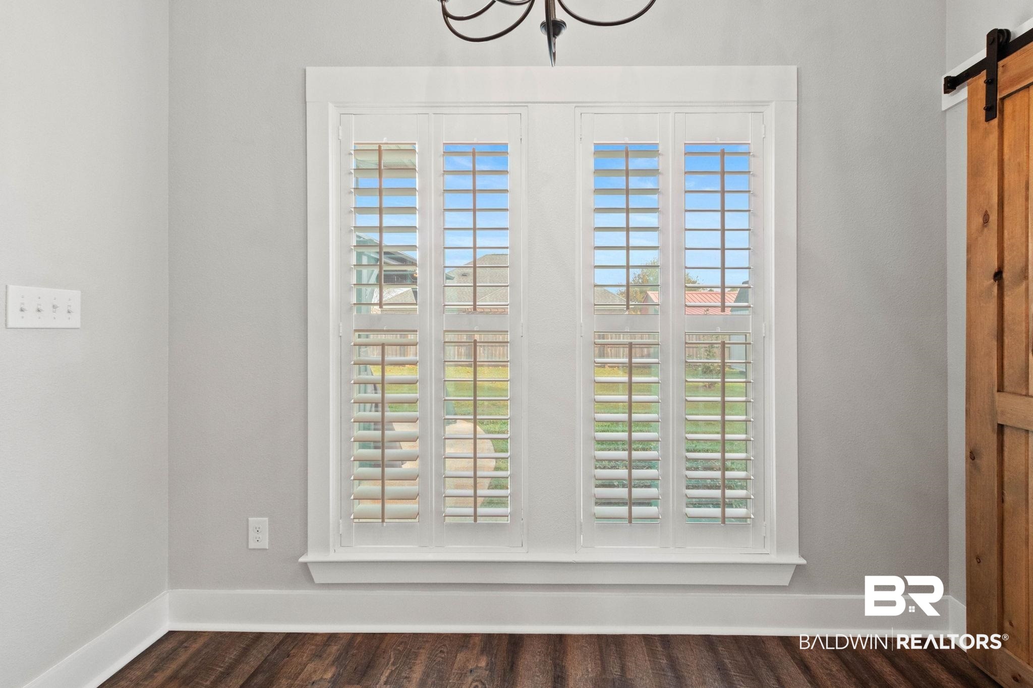 17376 Bankhead Boulevard Fairhope, AL 36532 - Photo 30 of 73 Detailed view of a barn door and wood finished floors
