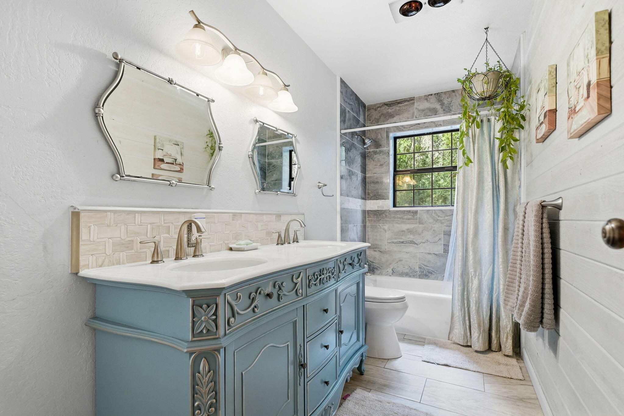 7758 Hidden Meadows Road Shingletown, CA 96088 - Photo 27 of 63 a bathroom with a granite countertop sink a toilet a mirror and shower