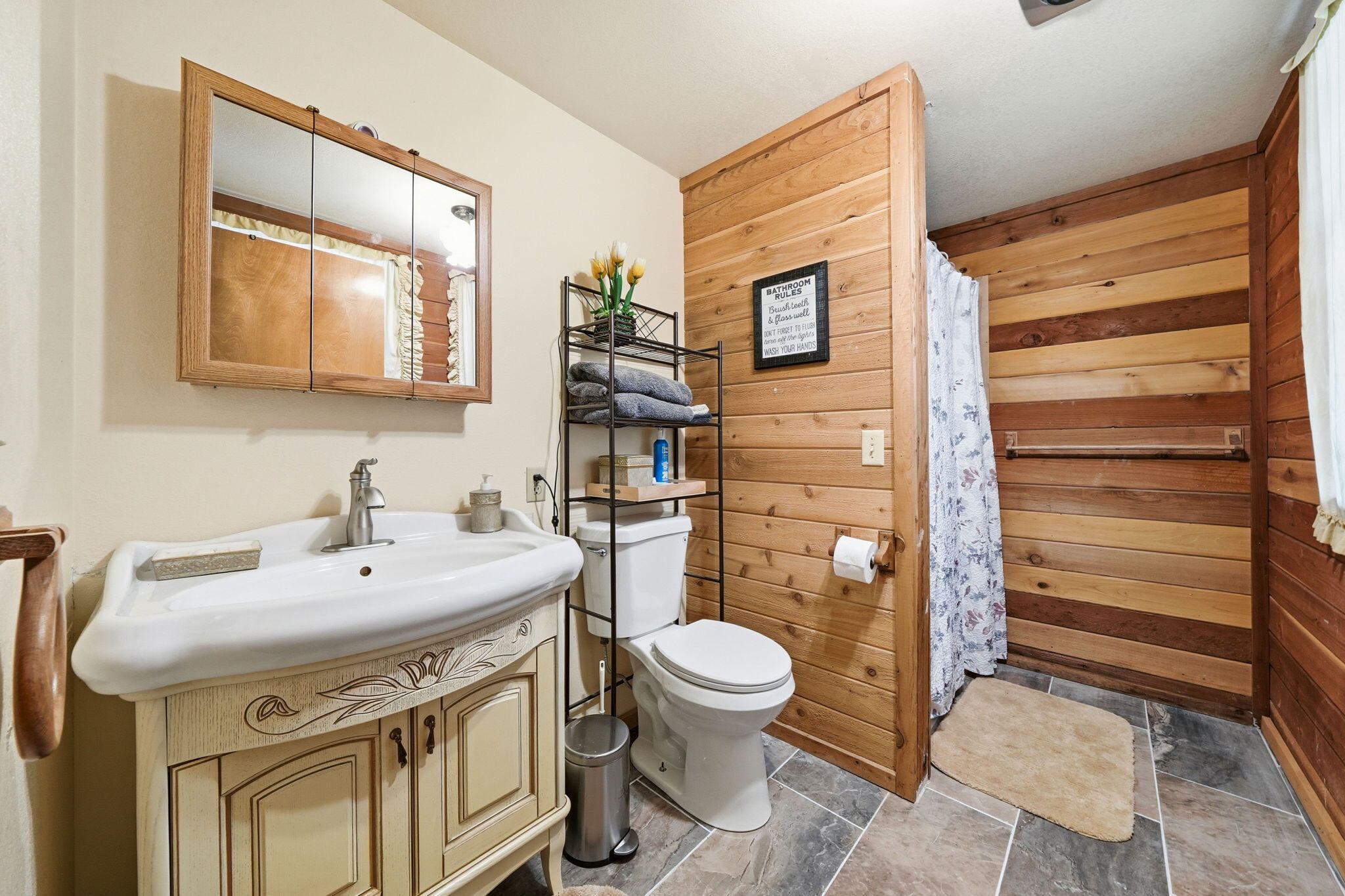 7758 Hidden Meadows Road Shingletown, CA 96088 - Photo 36 of 63 a bathroom with a sink toilet and mirror