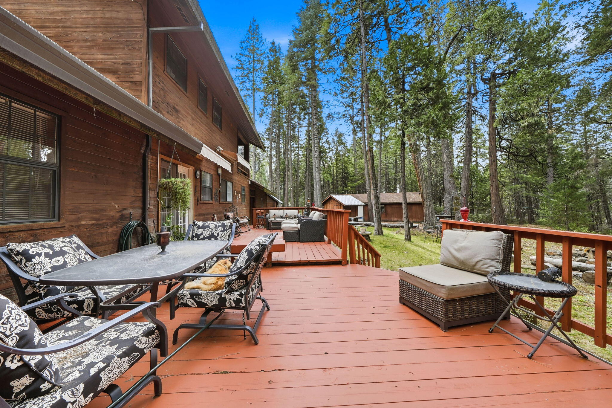 7758 Hidden Meadows Road Shingletown, CA 96088 - Photo 39 of 63 a view of a patio with couches table and chairs and potted plants