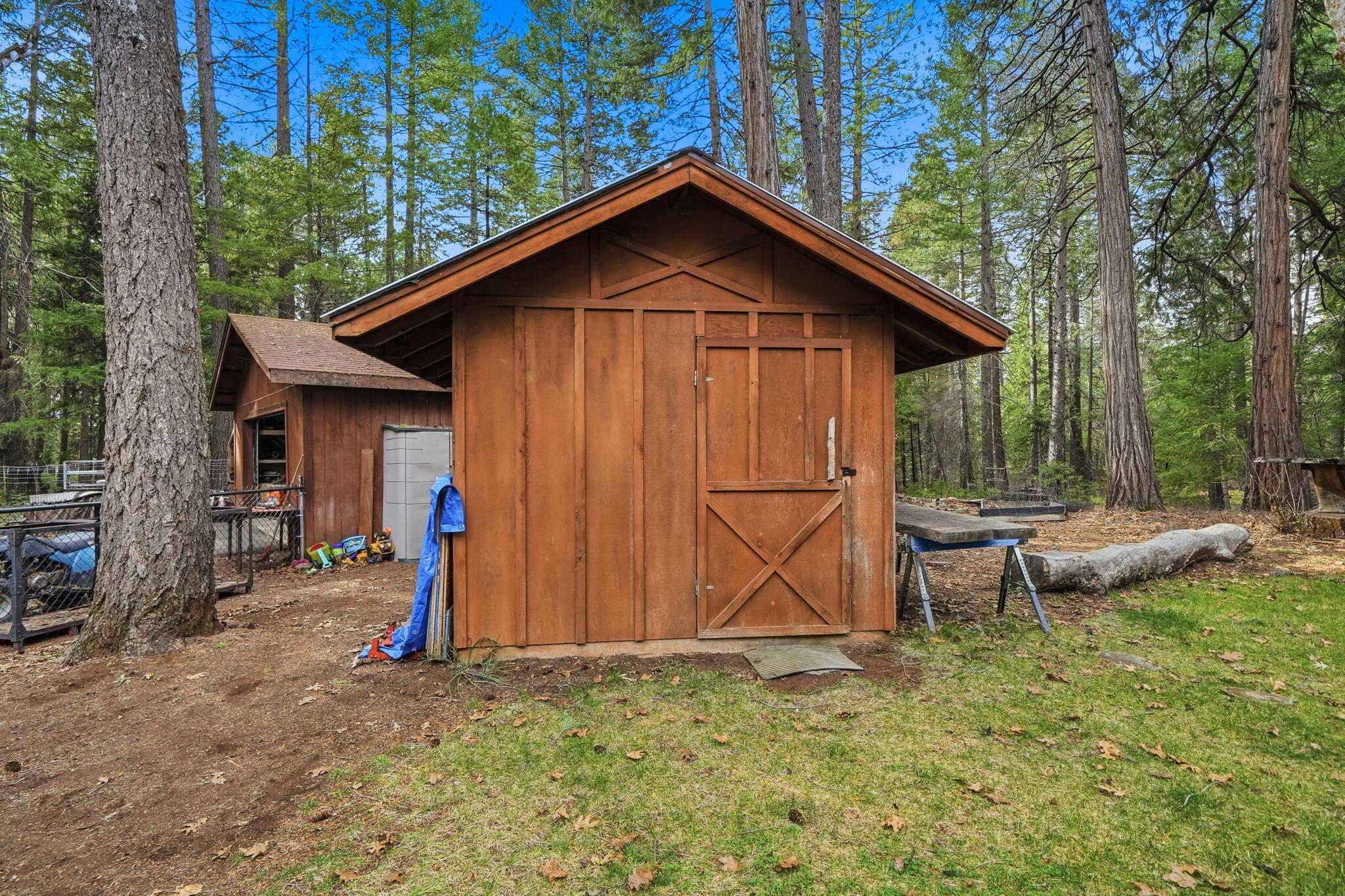 7758 Hidden Meadows Road Shingletown, CA 96088 - Photo 51 of 63 a view of a small house with a yard
