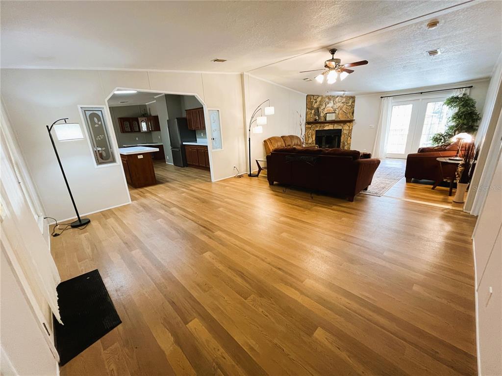 7750 156th Terrace Live Oak, FL 32060 - Photo 12 of 41 a living room with furniture and a flat screen tv