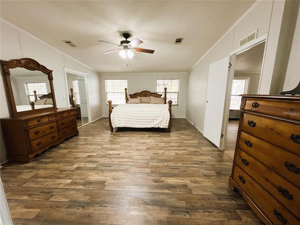 7750 156th Terrace Live Oak, FL 32060 - Photo 15 of 41 a living room with furniture and a flat screen tv