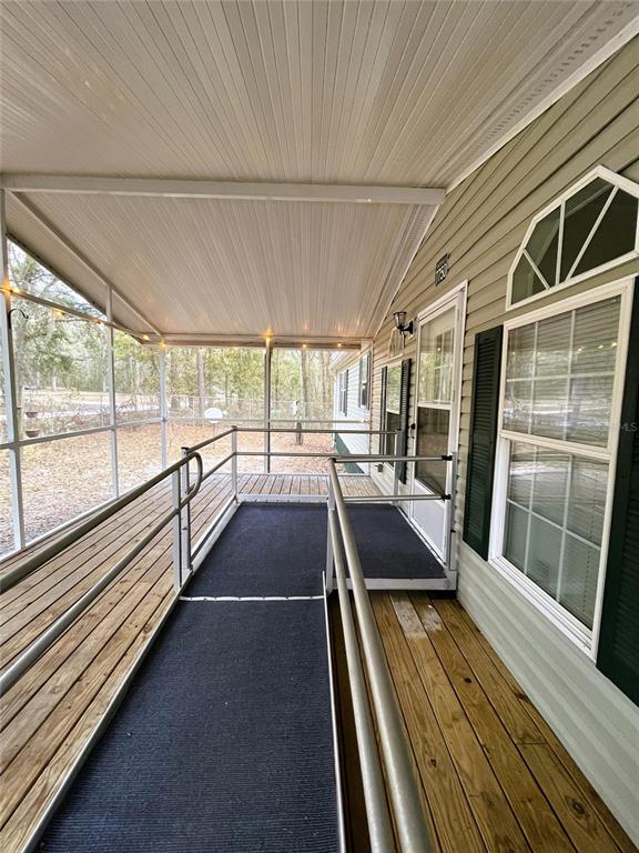 7750 156th Terrace Live Oak, FL 32060 - Photo 2 of 41 a view of a balcony with wooden floor