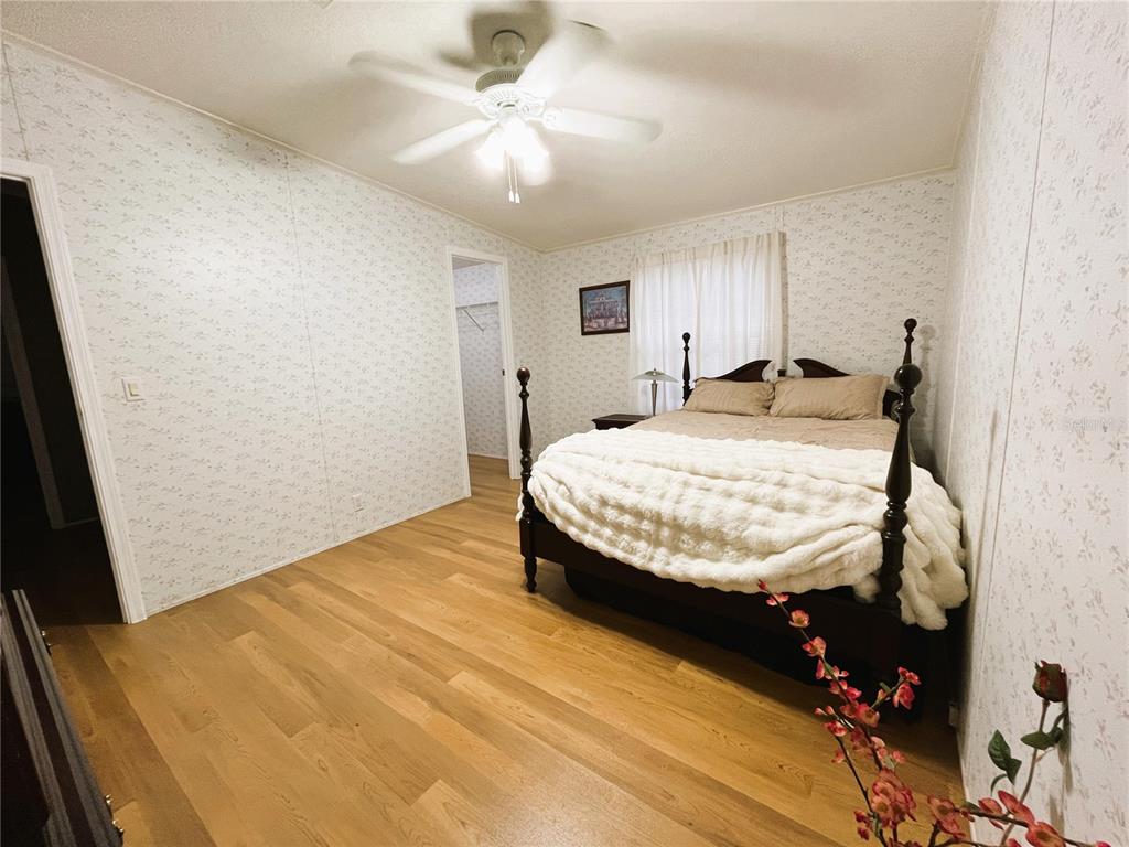 7750 156th Terrace Live Oak, FL 32060 - Photo 23 of 41 a bedroom with a bed and window