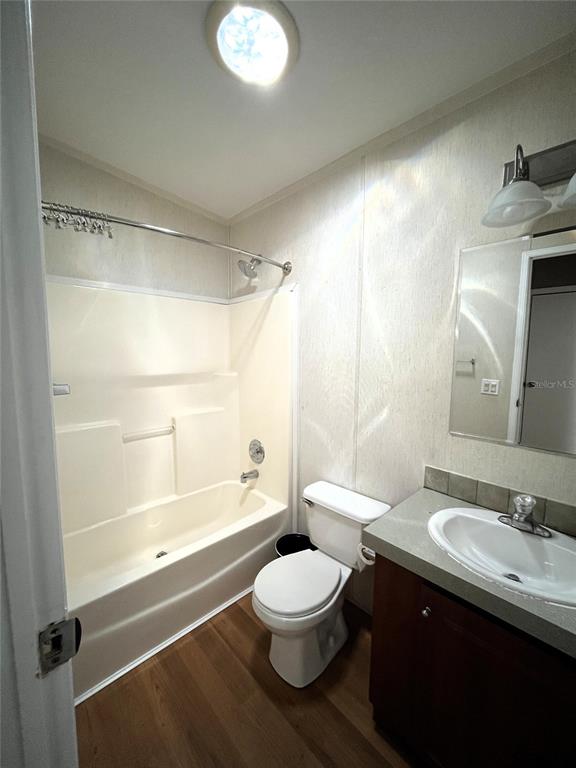 7750 156th Terrace Live Oak, FL 32060 - Photo 25 of 41 a bathroom with a double vanity sink toilet mirror and shower