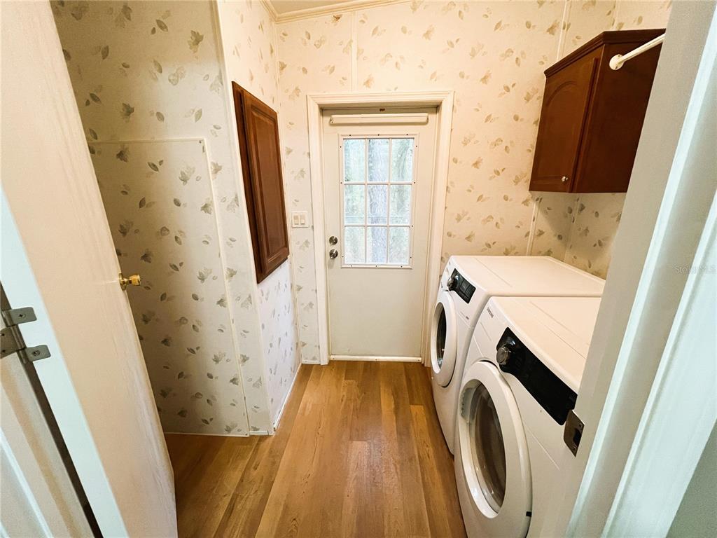 7750 156th Terrace Live Oak, FL 32060 - Photo 28 of 41 a bathroom with a sink and a washer dryer