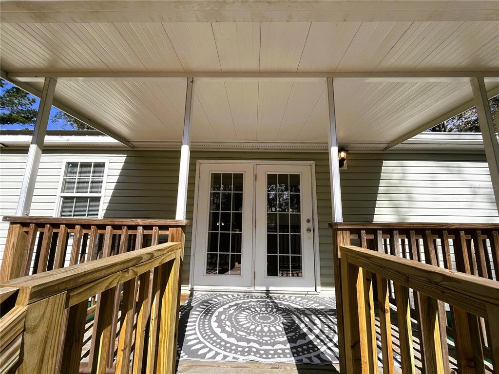 7750 156th Terrace Live Oak, FL 32060 - Photo 29 of 41 a view of a house with wooden deck