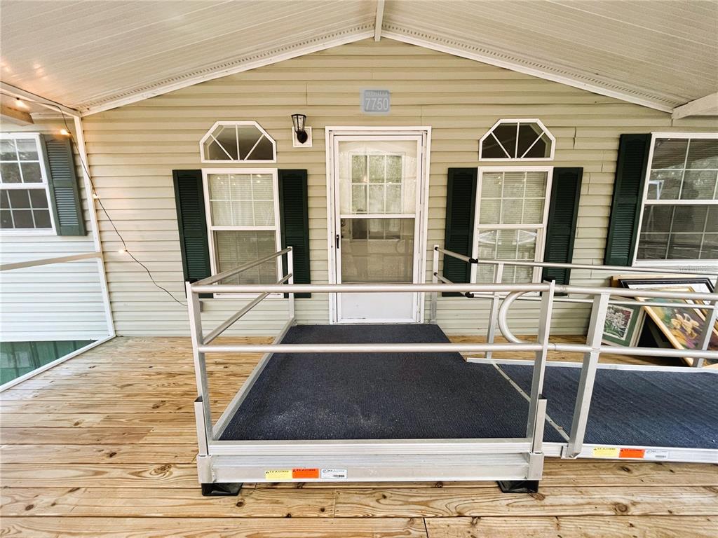 7750 156th Terrace Live Oak, FL 32060 - Photo 8 of 41 a view of a patio with table and chairs