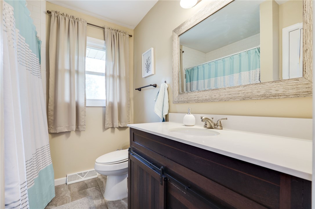 6950 Red Lion 5 Points Road Springboro, OH 45066 - Photo 38 of 78 This bathroom features a contemporary vanity and elegant tile flooring.