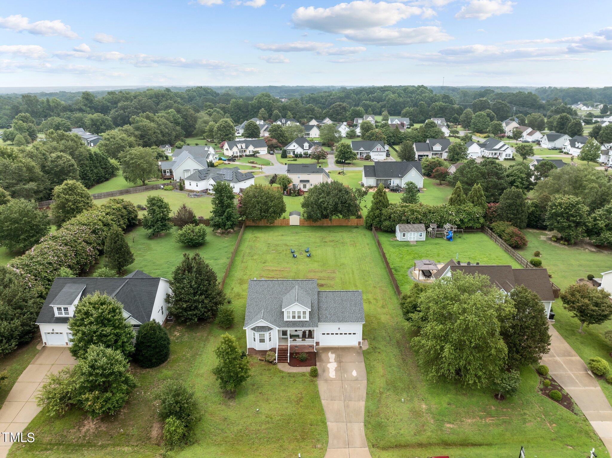 8809 Oregon Inlet Court Raleigh, NC 27603 - Photo 51 of 53 an aerial view of a house with a garden