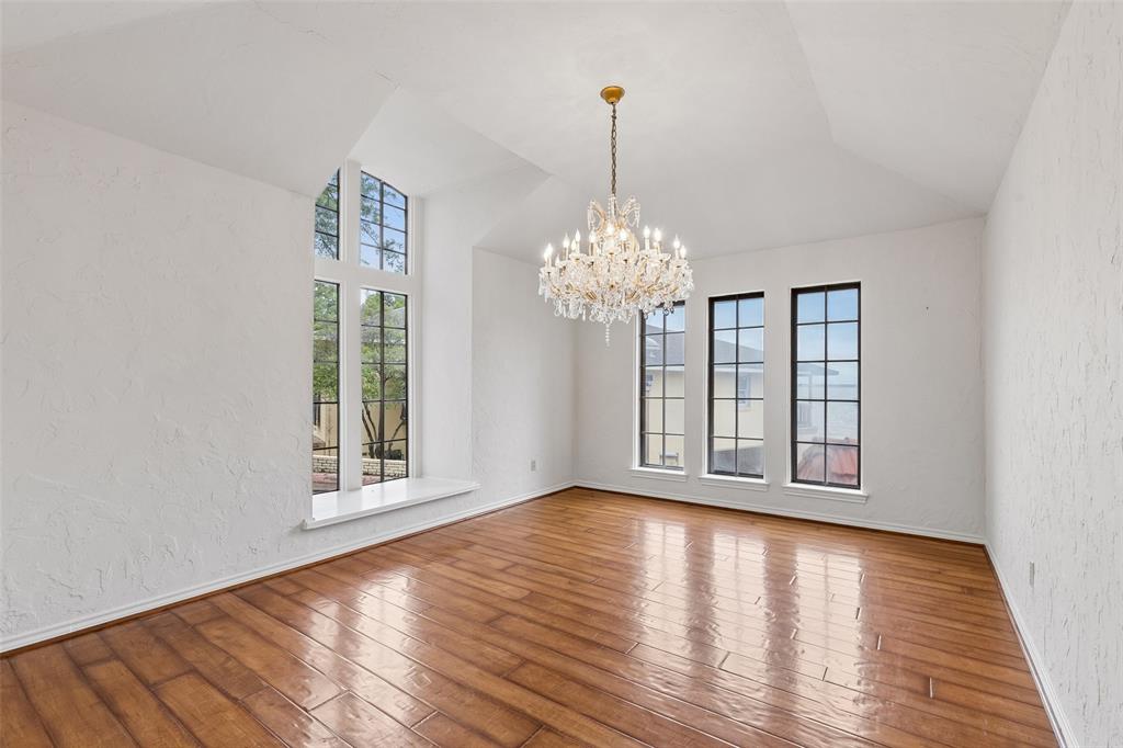 4 Eastshore Road Heath, TX 75032 - Photo 10 of 37 a view of an empty room with wooden floor and a window