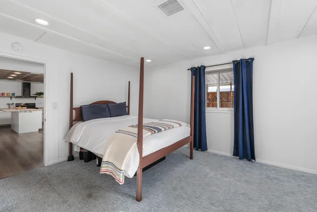 a bed room with a bed and a view