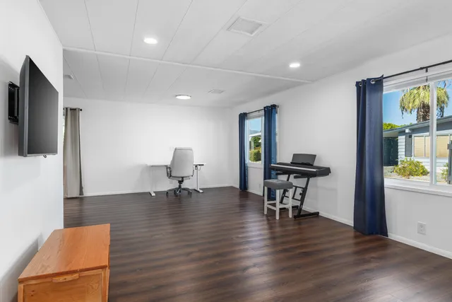 a living room with furniture and a table