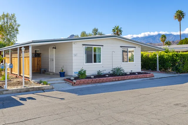a view of a house with entertaining space and plants