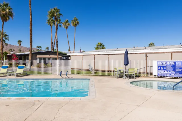 a view of a swimming pool and a chair