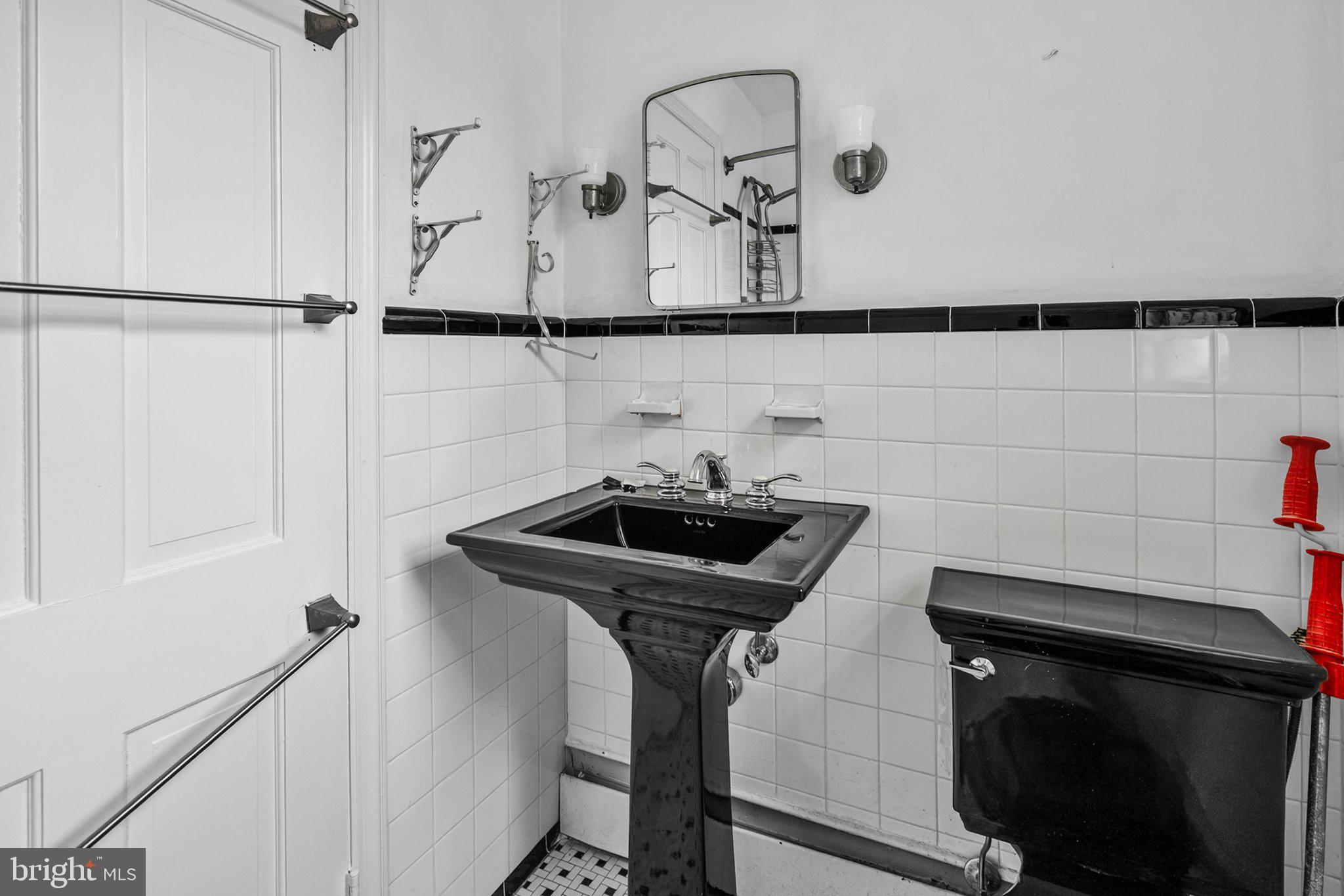241 Edwards Ferry Road Northeast Leesburg, VA 20176 - Photo 25 of 27 Chic monochrome bathroom elegance.