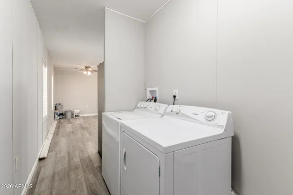 a view of a backyard with wooden fence