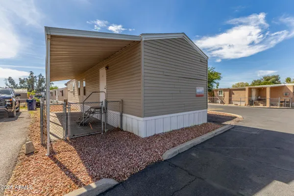 a view of balcony with wooden floor and outdoor seating