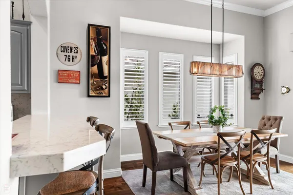 a view of a dining room with furniture window and wooden floor