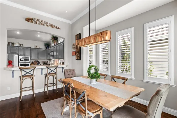 a view of a dining room with furniture window and wooden floor