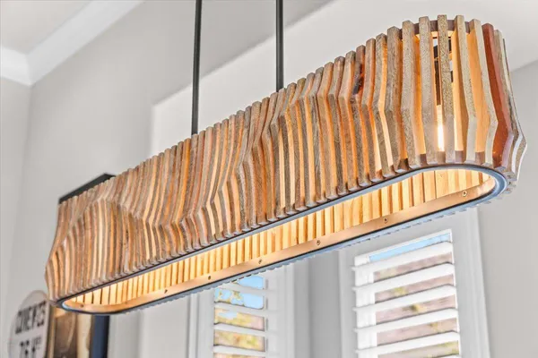 a kitchen with stainless steel appliances granite countertop a sink and dishwasher a refrigerator with wooden cabinets