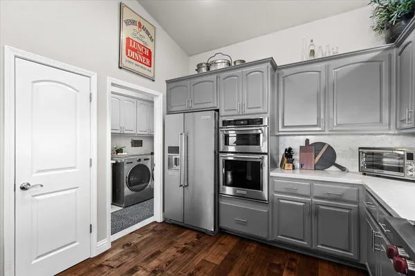 a kitchen with a sink and wooden cabinets