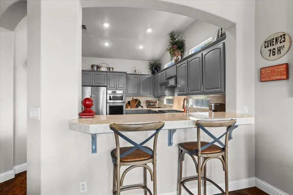 a bedroom with a bed and flat screen tv
