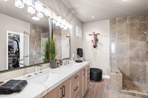 a spacious bedroom with a bed and a couch