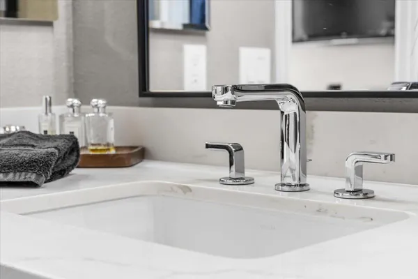 a view of a workspace with furniture and a potted plant
