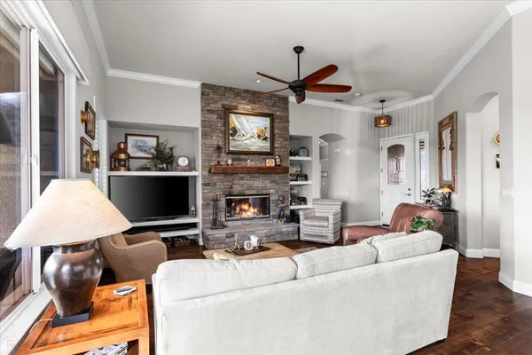 a living room with furniture and a large window