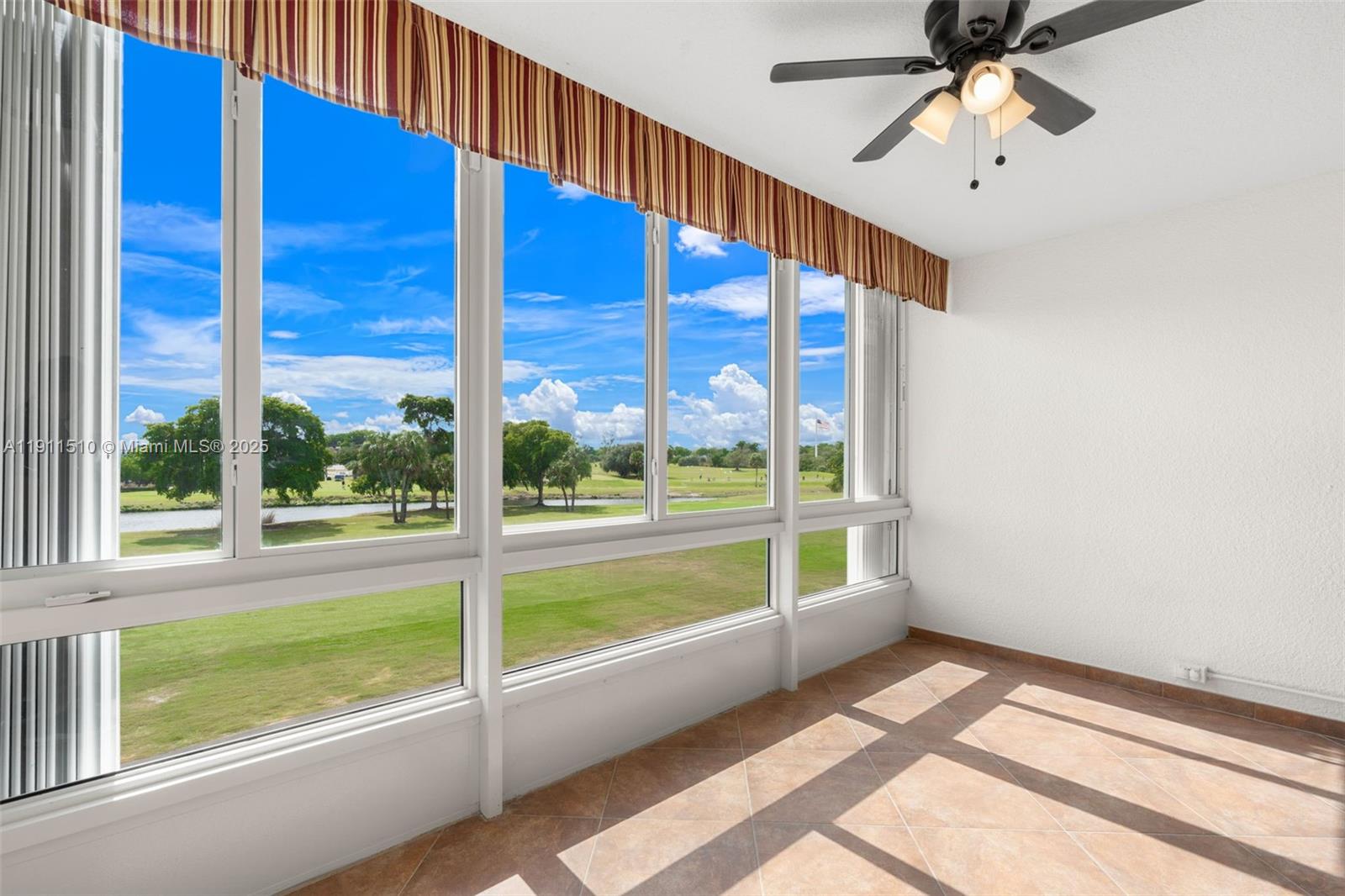 7640 Northwest 18th Street, Unit 301 Margate, FL 33063 - Photo 13 of 35 a view of an empty room with a window