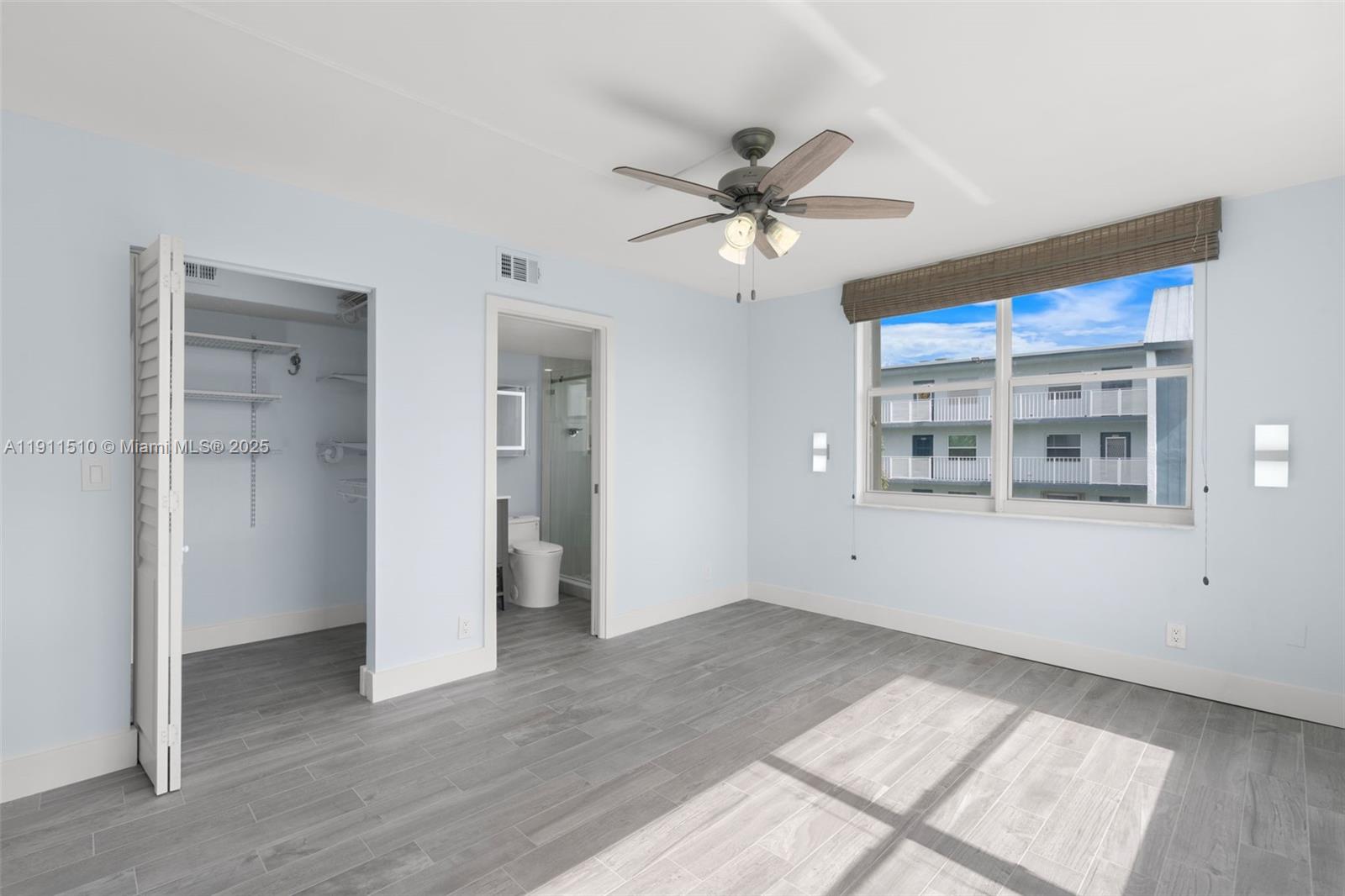 7640 Northwest 18th Street, Unit 301 Margate, FL 33063 - Photo 15 of 35 a view of a big room with wooden floor and windows