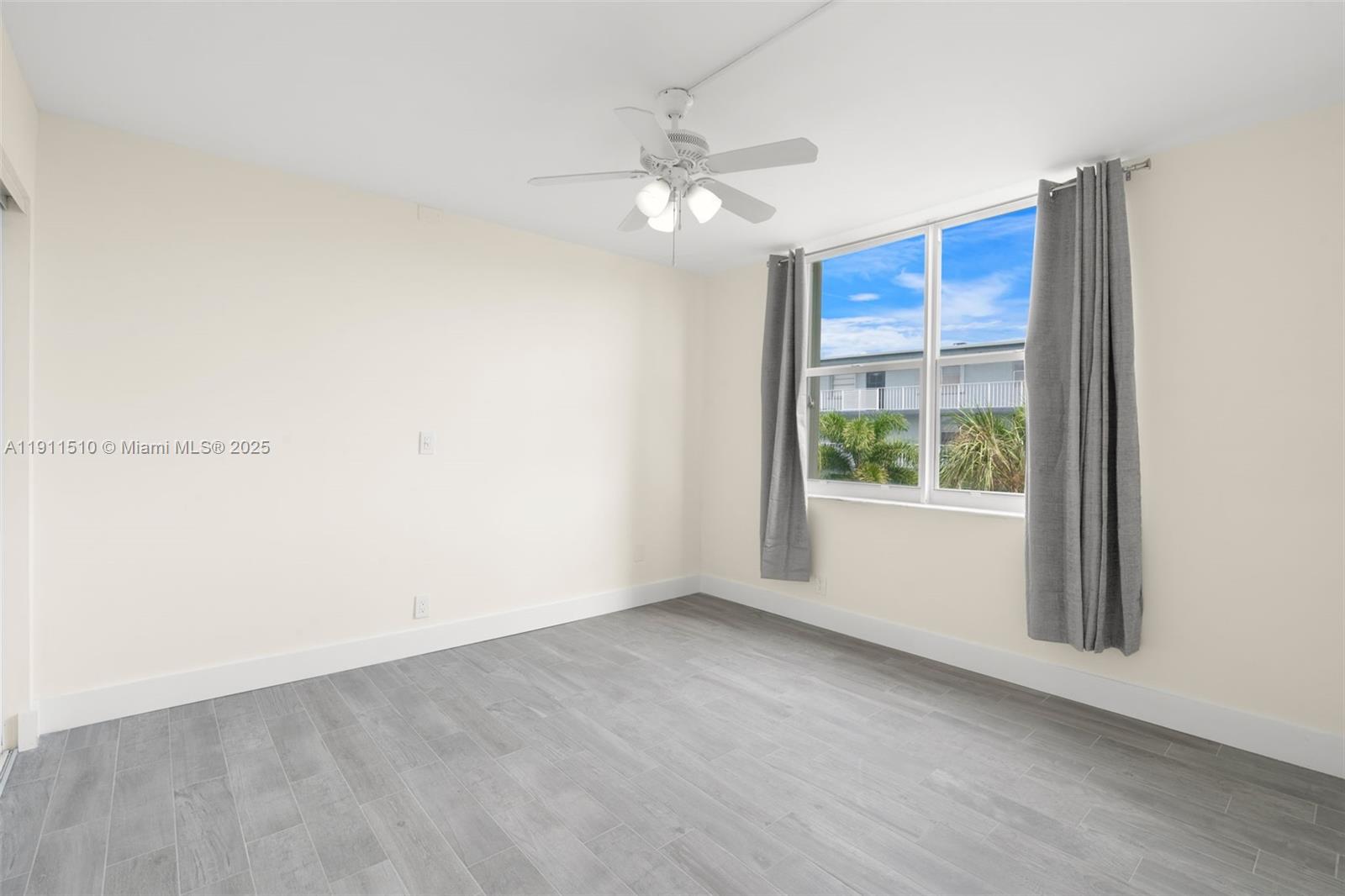 7640 Northwest 18th Street, Unit 301 Margate, FL 33063 - Photo 18 of 35 a view of an empty room with a window
